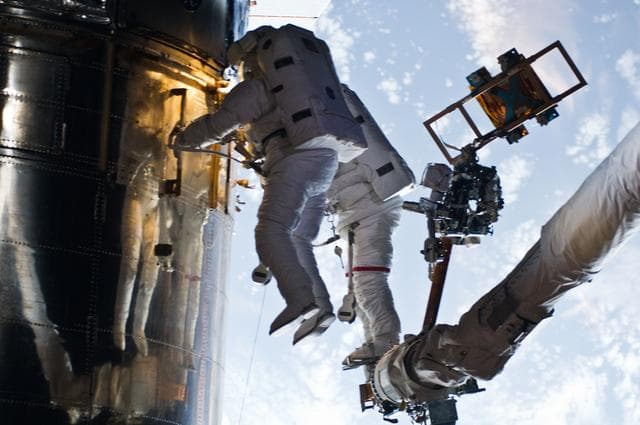 NASA image: STS-125 MS3 Grunsfeld and MS5 Feustel during EVA5