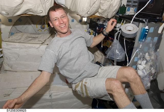 NASA image: STS-125 Pilot Gregory Johnson poses for a photo on the Middeck