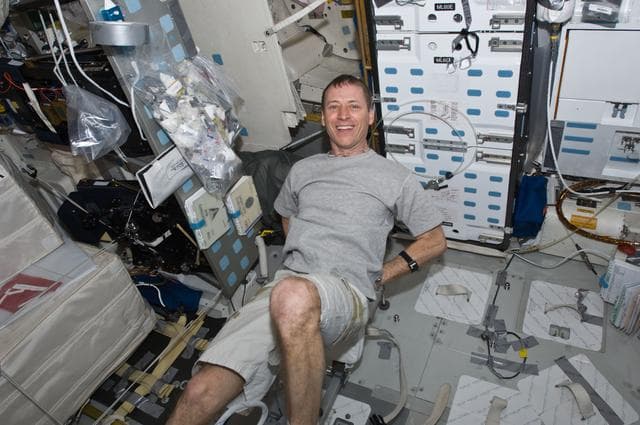 NASA image: STS-125 Pilot Gregory Johnson exercises in the MDDK