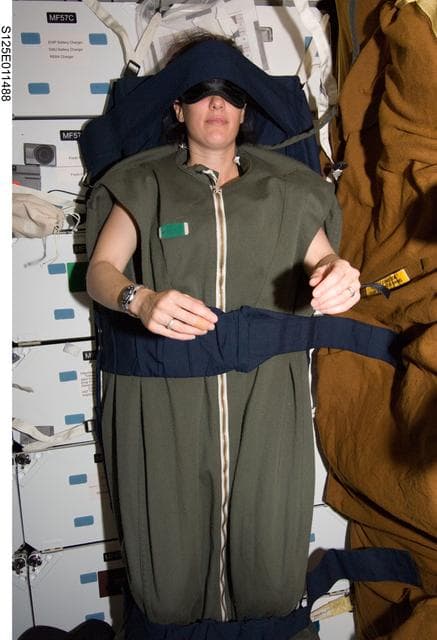 NASA image: MS2 Megan McArthur sleeps on the Middeck