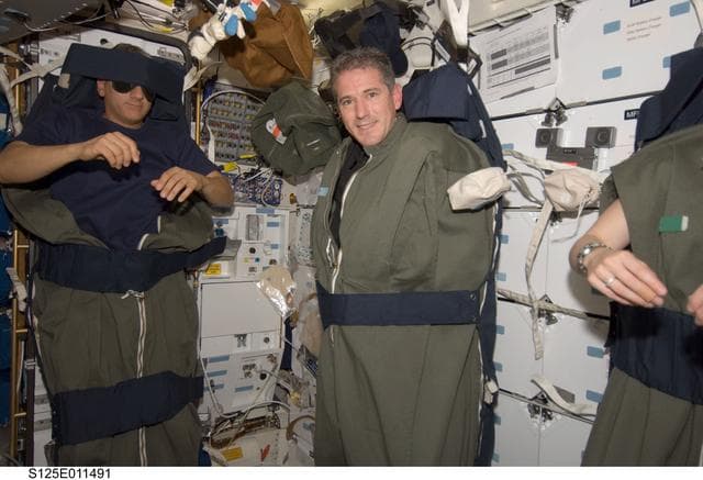 NASA image: STS-125 Crew Members on the Middeck