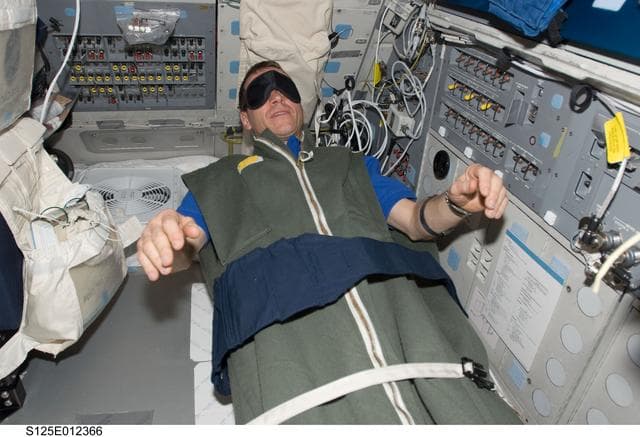 NASA image: STS-125 Pilot Gregory C. Johnson on the Flight Deck
