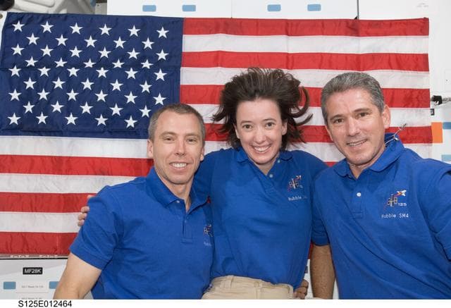 NASA image: STS-125 Crew Members pose for a photo on the Middeck