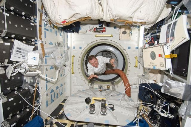NASA image: View of Pilot Gregory Johnson posing for a photo in the Middeck