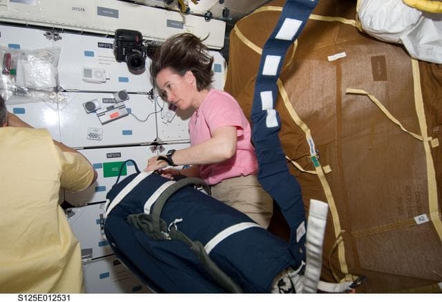 NASA image: View of STS-125 MS Megan McArthur in the Middeck