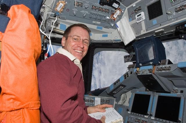 NASA image: View of Pilot Gregory Johnson posing for a photo on the Flight Deck