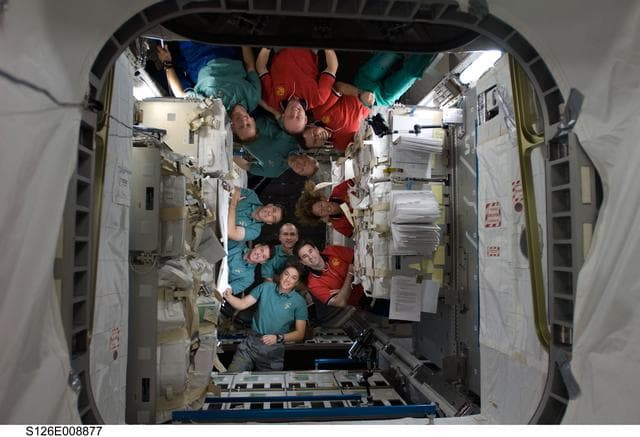NASA image: STS-126 and Expedition 18 Crewmembers In-Flight Portrait in MPLM