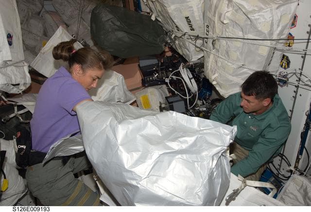 NASA image: Stefanyshyn-Piper and Kimbrough in Node 1