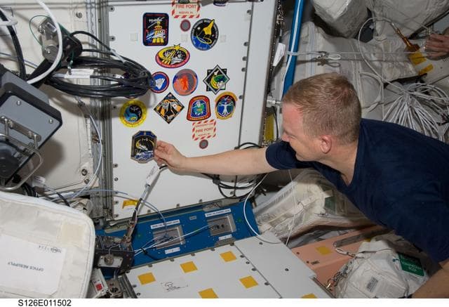 NASA image: Boe adds Mission Patch in Node 1