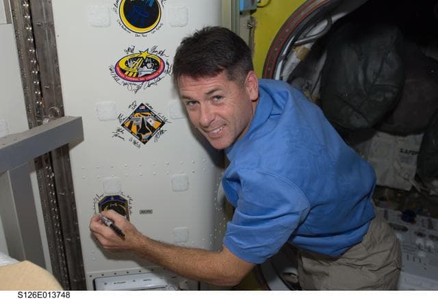 NASA image: Kimbrough signs Mission Patch in A/L