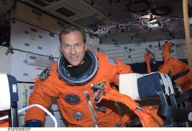 NASA image: Marshburn wears LES in the FWD MDDK of Space Shuttle Endeavor during STS-127 Mission