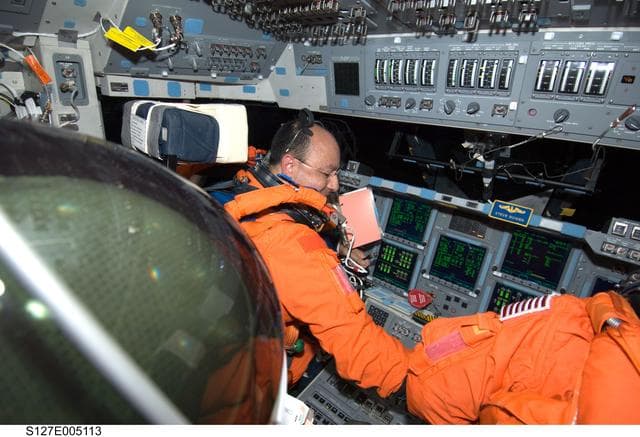 NASA image: Polansky and Hurley in the FWD FD of Space Shuttle Endeavor during STS-127 Mission