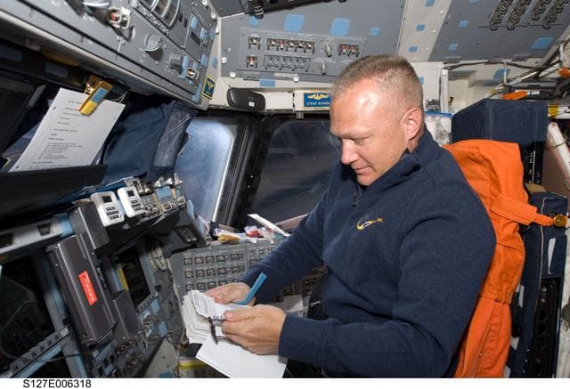 NASA image: Hurley looks at Crew Procedures in the FD on the Space Shuttle Endeavour during the STS-127 Mission
