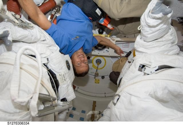 NASA image: Marshburn upside down in the Shuttle A/L on the Space Shuttle Endeavour during the STS-127 Mission