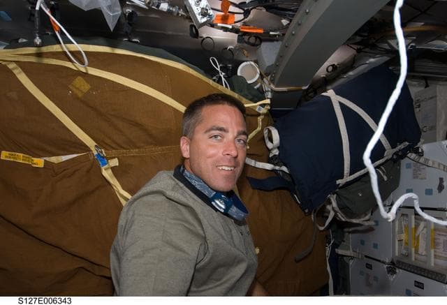 NASA image: Cassidy in the MDDK on the Space Shuttle Endeavour during the STS-127 Mission
