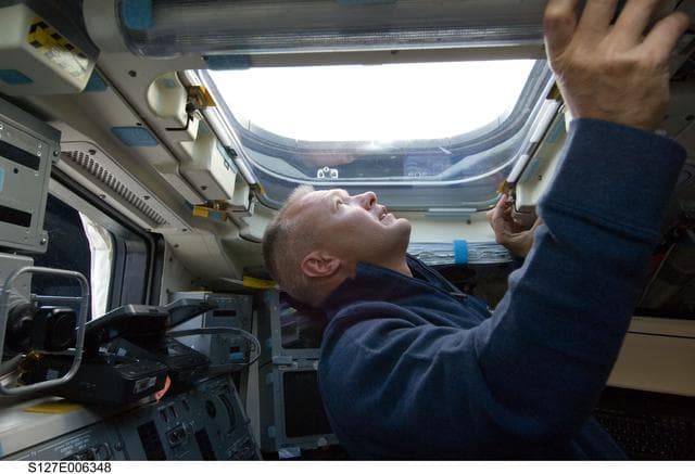NASA image: Hurley looks out window in the aft FD on the Space Shuttle Endeavour during the STS-127 Mission