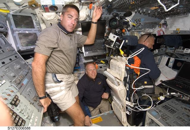 NASA image: Cassidy,Kopra,and Hurley in the FD during docking activities of Space Shuttle Endeavour