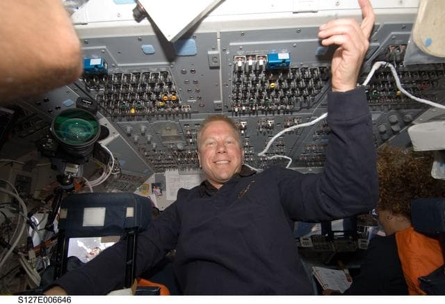NASA image: Kopra and Payette in the aft FD during docking activities of Space Shuttle Endeavour
