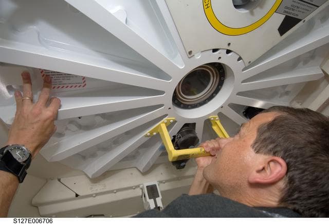 NASA image: Marshburn looks through window into the PMA-2 during STS-127 Mission