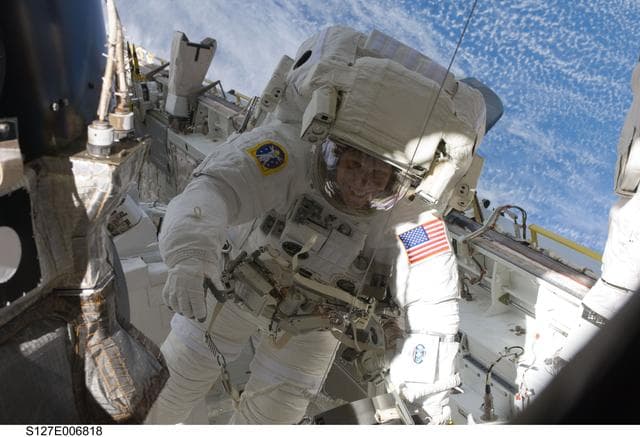 NASA image: Kopra in Endeavours Payload Cargo Bay during EVA-1 on STS-127 / Expedition 20 Joint Operations