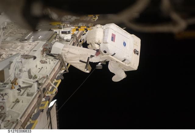 NASA image: Kopra in Endeavours Payload Cargo Bay during EVA-1 on STS-127 / Expedition 20 Joint Operations