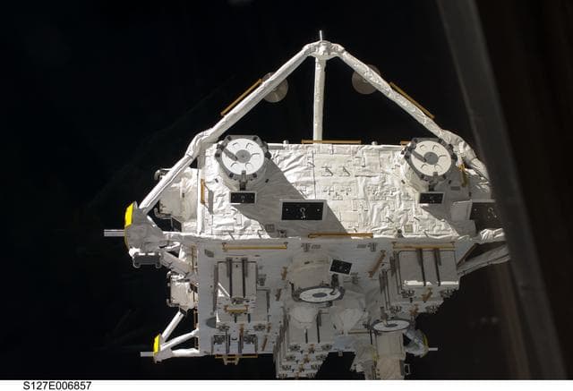NASA image: SSRMS moves JEF during EVA-1 on STS-127 / Expedition 20 Joint Operations
