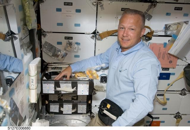 NASA image: Hurley in the FWD MDDK during STS-127 / Expedition 20 Joint Operations