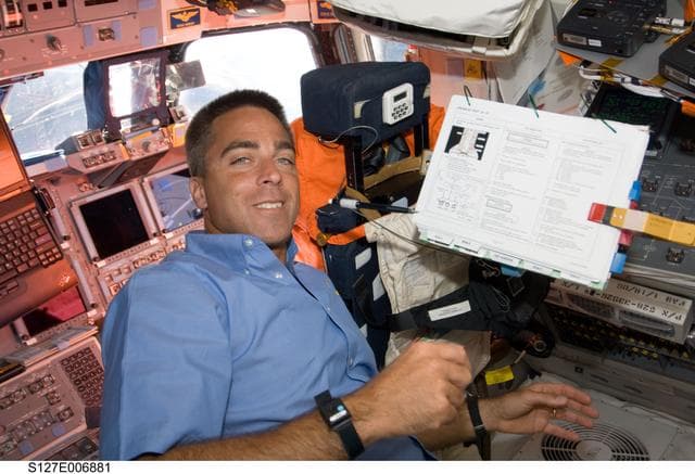 NASA image: Cassidy looks over Crew Procedures during EVA-1