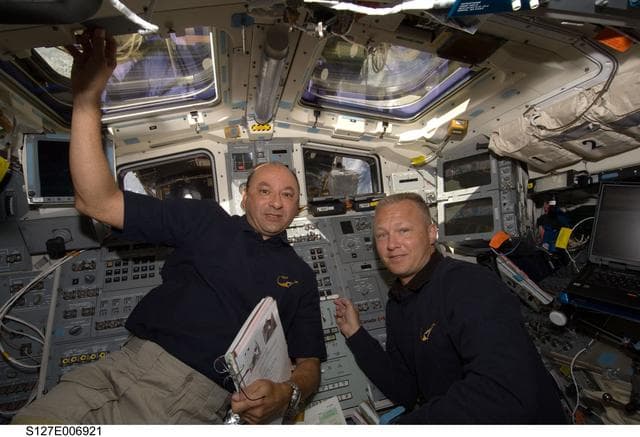 NASA image: Polansky and Hurley in the aft FD during STS-127 / Expedition 20 Joint Operations