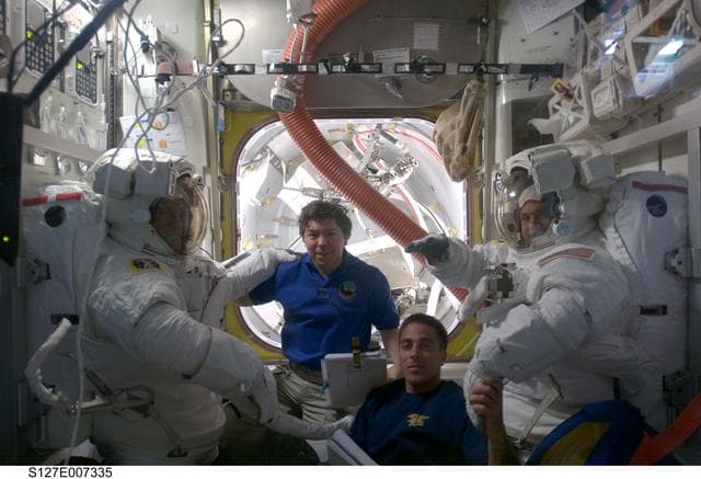 NASA image: Cassidy waves to camera during EVA-2 Preparation in the A/L during Joint Operations