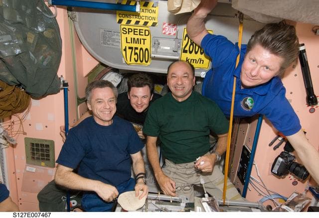 NASA image: STS-127 / Expedition 20 Crewmembers eating in the Node 1 during Joint Operations