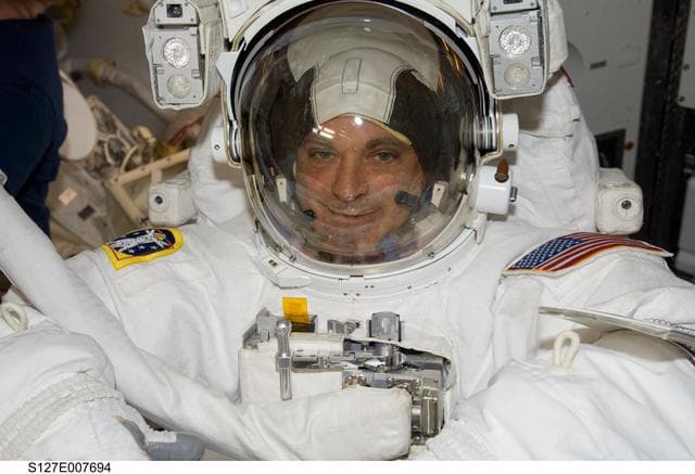 NASA image: Wolf with his EMU in the A/L
