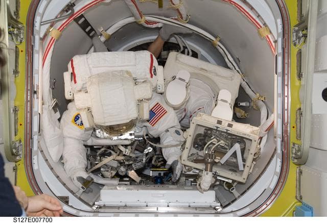 NASA image: Wolf and Cassidy in the A/L during EVA-3 Preparation