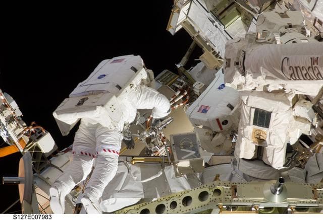 NASA image: Wolf and Cassidy works with the ICC during EVA-3