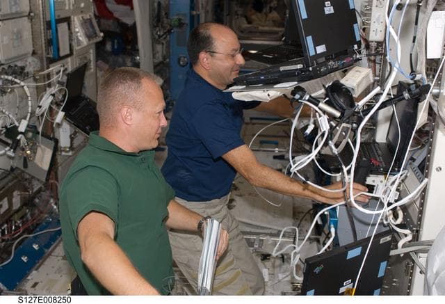 NASA image: Hurley and Polansky at the JEMRMS in the JEM during Joint Operations