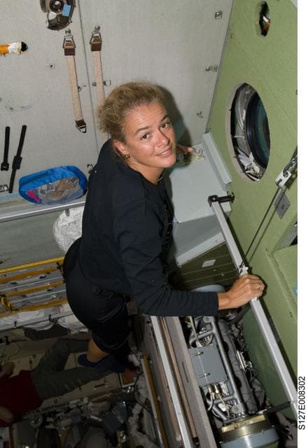NASA image: Payette looks out window in the SM during Joint Operations
