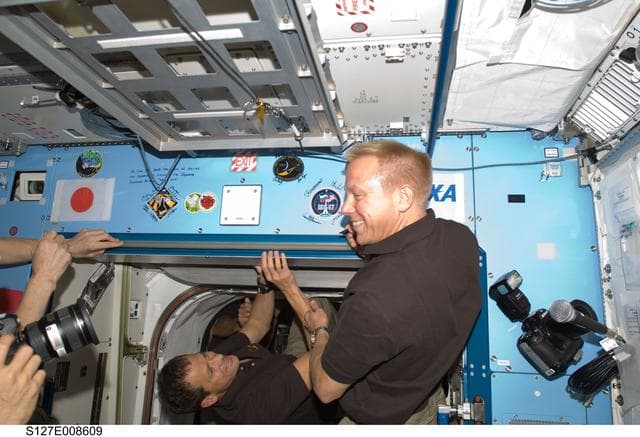 NASA image: Kopra signs mission decal in the JEM during Joint Operations