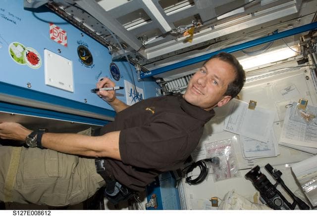 NASA image: Marshburn signs mission decal in the JEM during Joint Operations