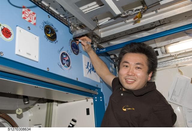 NASA image: Wakata signs mission decal in the JEM during Joint Operations