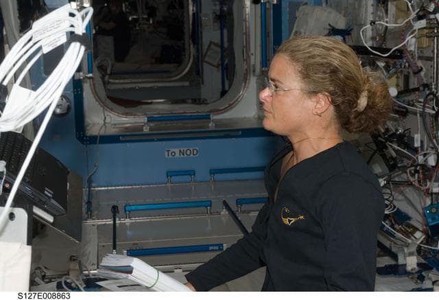 NASA image: Payette at the JEMRMS in the JEM during Joint Operations