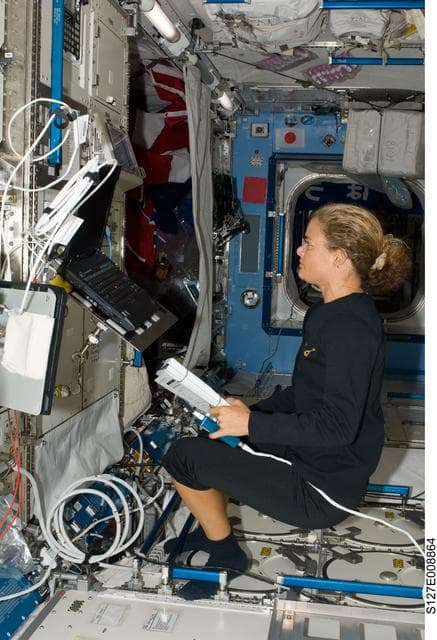 NASA image: Payette at the JEMRMS in the JEM during Joint Operations