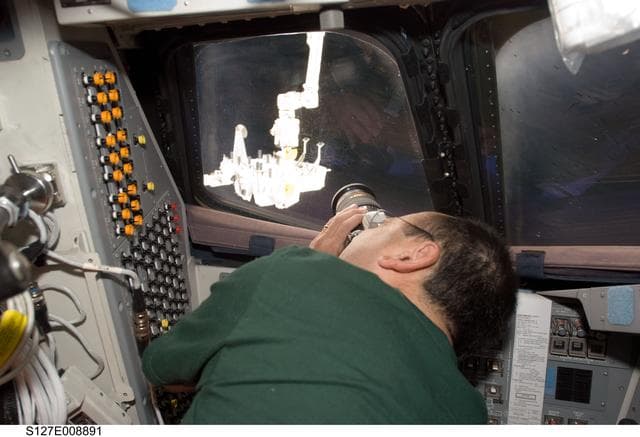 NASA image: Polansky uses camera in the FD of Endeavour during Joint Operations