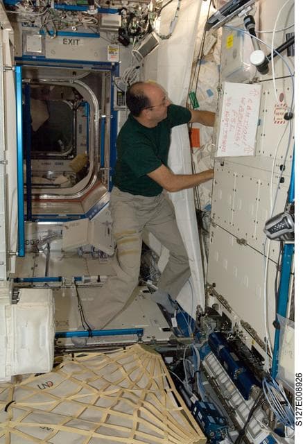 NASA image: Polansky works in the U.S. Laboratory during Joint Operations
