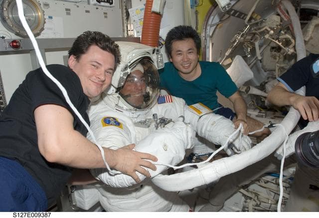 NASA image: Romanenko and Wakata pose with Cassidy in the A/L after EVA-5