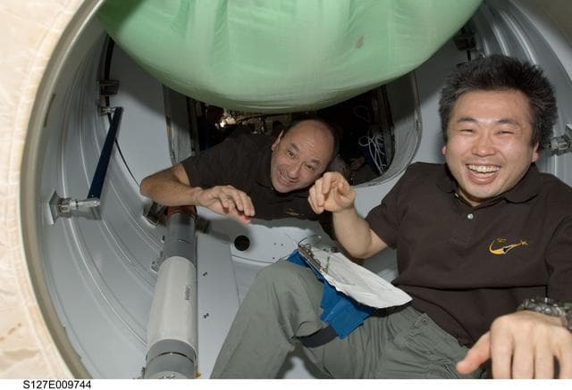 NASA image: Polansky and Wakata in the PMA-2 during Joint Operations