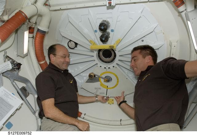 NASA image: Polansky and Cassidy in the A/L of Endeavour