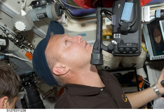 NASA image: Hurley looks through window in the aft FD during Joint Operations