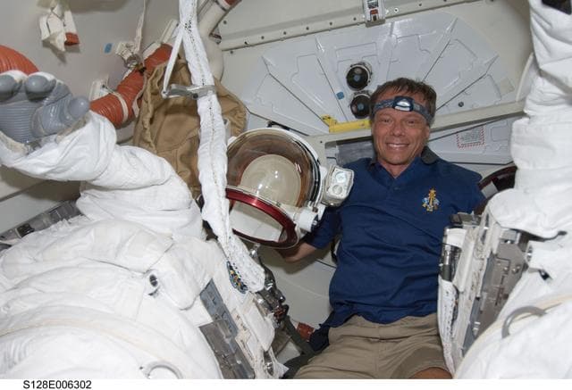 NASA image: Fuglesang in Shuttle Airlock with Extravehicular Mobility Units (EMU)s during STS-128