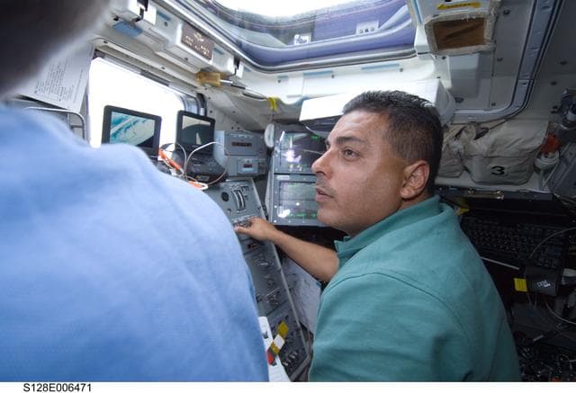 NASA image: Forrester and Hernandez on Flight Deck (FD) during OBSS OPS