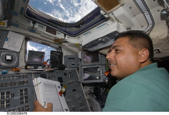 NASA image: Hernandez on Flight Deck (FD) during OBSS OPS